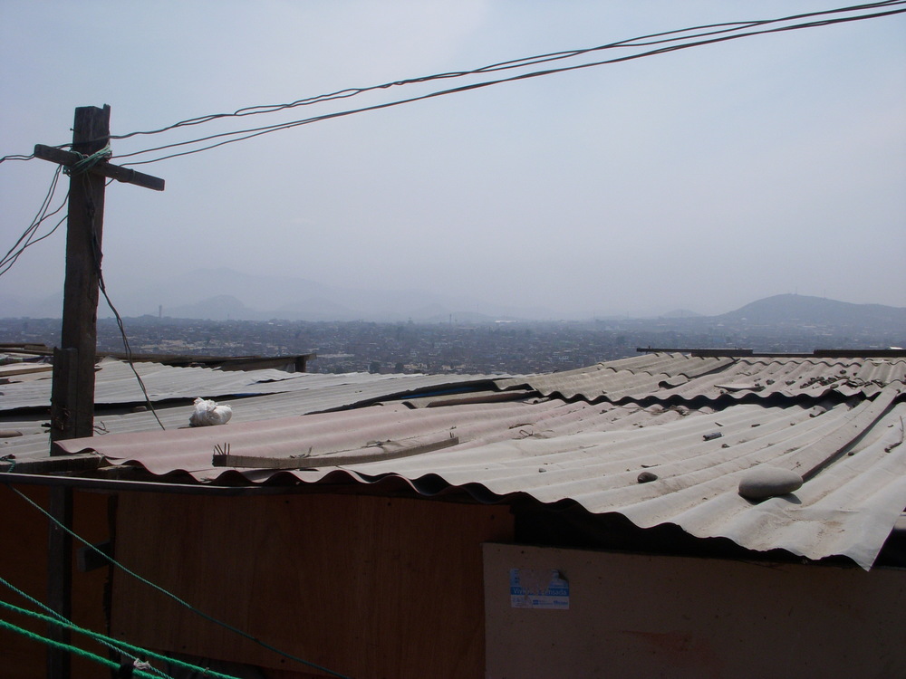  A photo overlooking some of Villa El Salvador. It began as a pueblo jóven (shantytown) in the vast, empty sand flats to the south of Lima in 1970 because of the urgent housing needs of immigrant families who had left the sierra of Peru. Villa El Salvador evolved into a huge urban zone, largely self-organizing, for which it won some fame. Largely through the efforts of its inhabitants, the neighborhood was supplied with electricity, water, and sewage. 