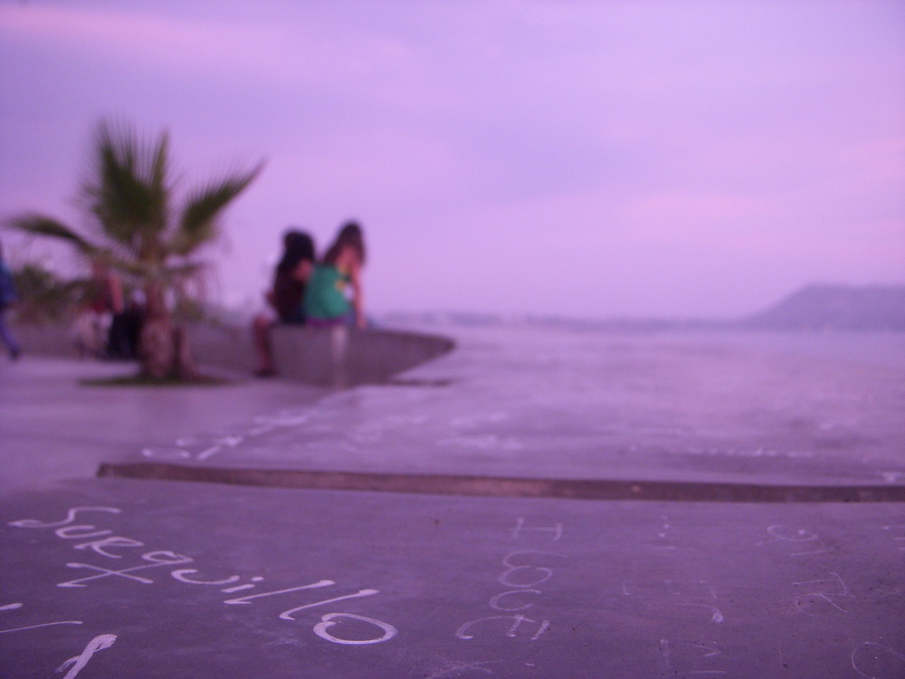  An artistic photo of The sidewalk in Parque Amor in Peru at Sunset. 