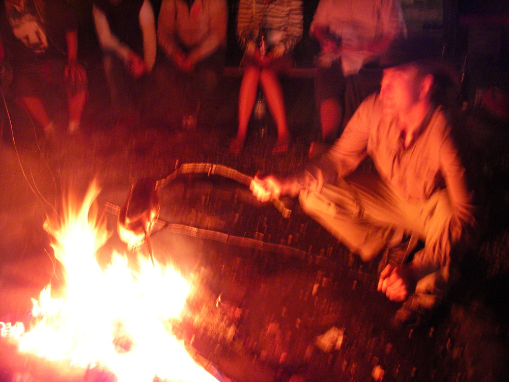  Trevor cooking a chicken over the fire while we are at The Tent Hostel in Münichen. 