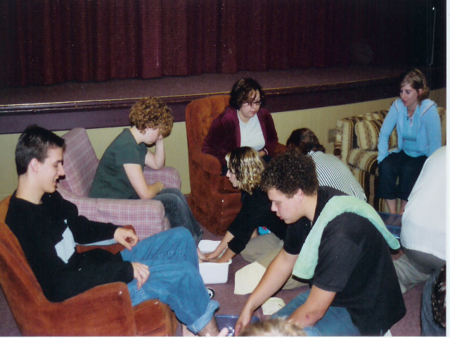 A photo of my fellow interns and I washing the feet of new students